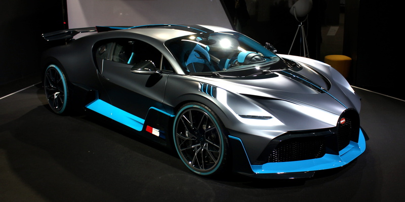 one person, transportation, style, bugatti, reflection, mode of transportation, luxury, sports car, shiny, fast, retail, wealth, motor vehicle, side view