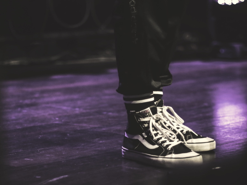 low section, heel, performer, human limb, sneaker, human foot, one person, standing, light, west jakarta, black, lifestyles, leisure activity, footwear