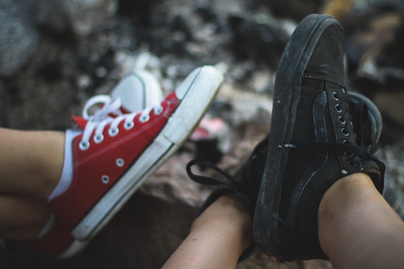 day, bokeh, vans, shoes, riding boot, real people, converse, body part, human body part, feet, personal perspective, sneaker, clothing, details, focus on foreground
