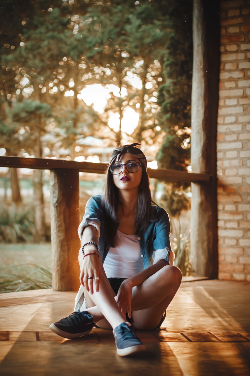 outdoors, fashion, long hair, bandana, attractive, headwear, wear, glasses, style, female, focus, posing, young adult, blur, depth of field, floor, beautiful woman