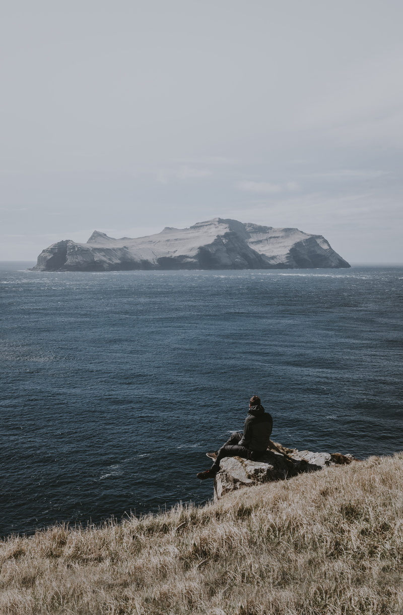 ocean, gasadalur, outdoors, people, scenics - nature, rock - object, solid, formation, sea, island, grass, rear view, horizon over water, edge, ledge, water