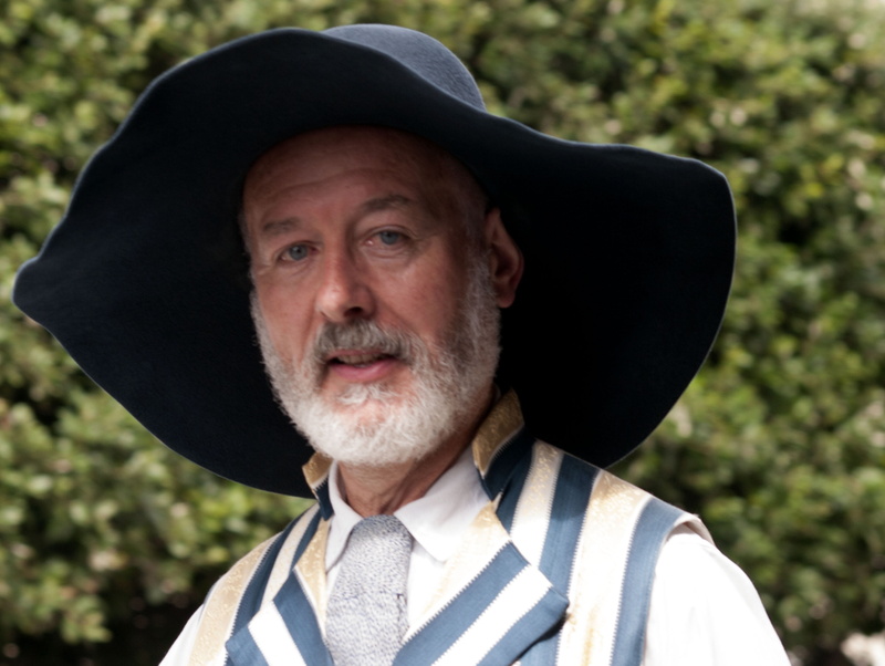 character, headshot, day, portrait, contemplation, mustache, beard, clothing, emotion, facial hair, focus on foreground, hat, close-up, breton, looking at camera