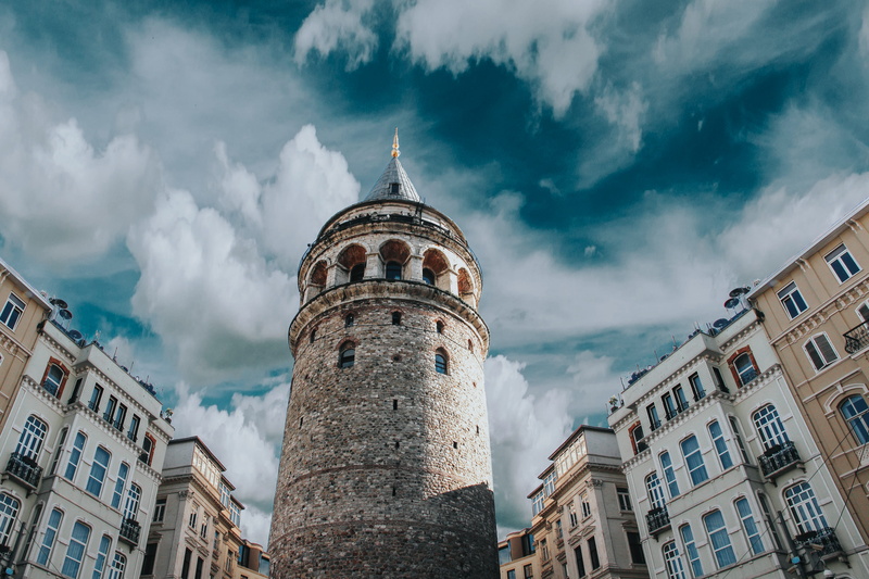 town, tourism, tower, sky, old city, low angle view, city, the past, religion, castle, day, travel, built structure, cathedral, cloud - sky, historic, landmark