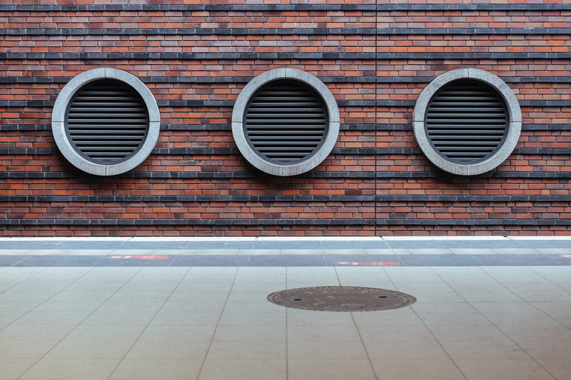 day, outdoors, minimalism, side by side, flooring, tiled floor, pattern, geometric shape, gray, wall - Building Feature, black, air conditioner, brick
