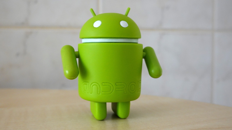 creativity, android, wall - building feature, single object, indoors, flooring, focus on foreground, wood - material, smartphone, google, finance, green color