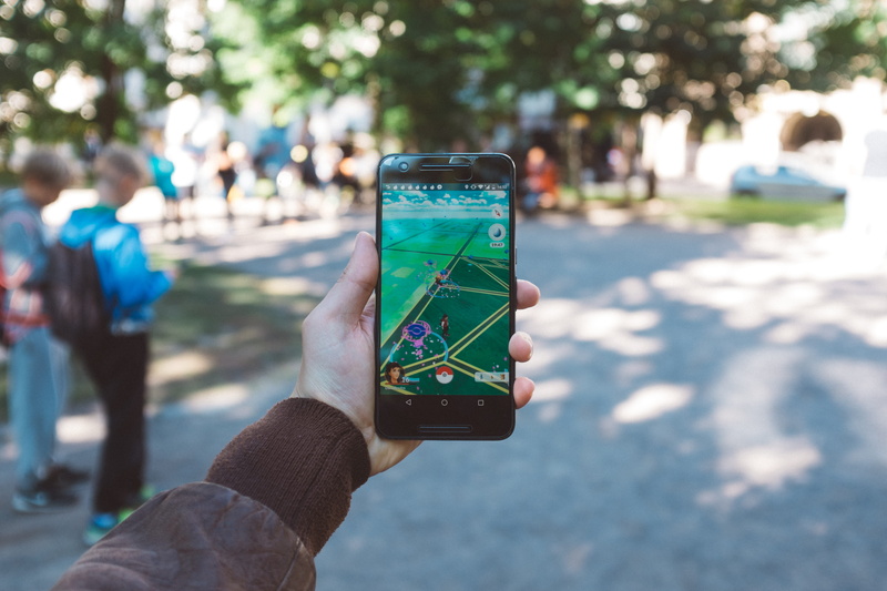 go, technology, portable information device, black, Pokemon Go, wireless technology, human hand, pokemon, focus on foreground, city, photography themes