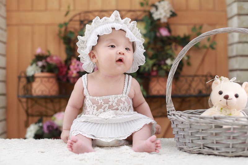babyhood, babies only, head band, white color, young, one person, head, brilliant, brown, white, doll, container, innocence, white yarn, front view, hundred days