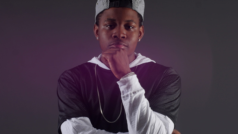 chain, black background, 4K, headshot, guy, iphone, one person, purple, pose, young men, young adult, standing, colored background, contemplation, confidence