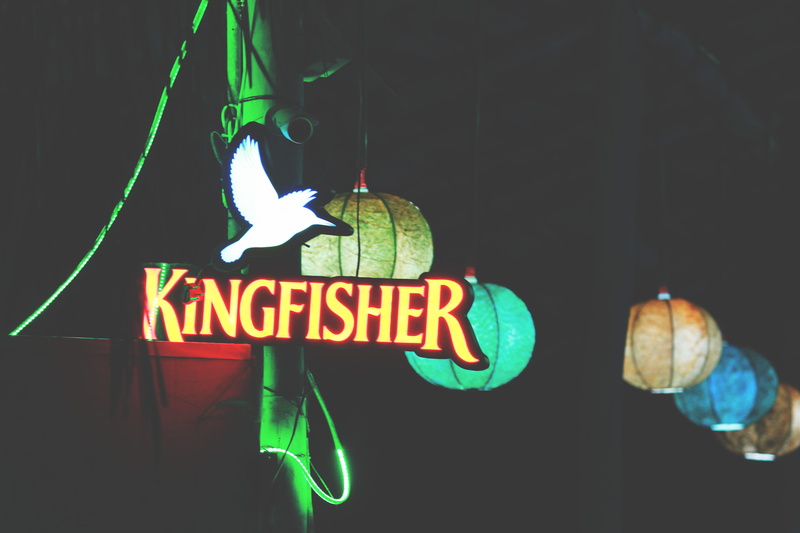 outdoors, night, calangute beach, black background, glowing, brokeh, representation, shack, nightlife, western script, text, dark, illuminated, low angle view