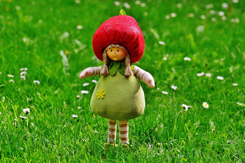 small, front view, plush, doll, meadow, childhood, innocence, grass, 5K, imp, decoration, hat, green color, sweet, are, plant, toy, child, clothing, full length