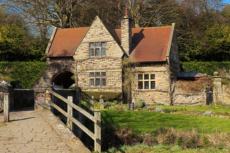 bridge, built structure, plant, building exterior, country, traditional, front, grass, green color, barrier, day, nature, brick, boundary, real estate