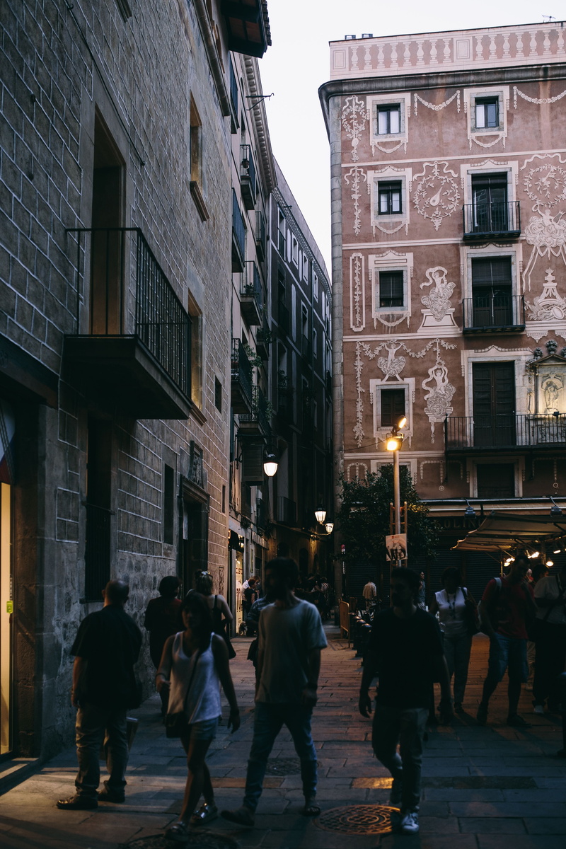 window, building exterior, housing, travel, men, townhouses, building, city life, old town, built structure, windows, women, crowd, facade, illuminated