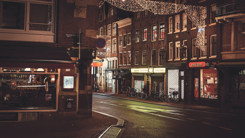 non-western script, photography, text, lighting equipment, Amsterdam, no people, built structure, architecture, bicycles, outdoors, mode of transportation