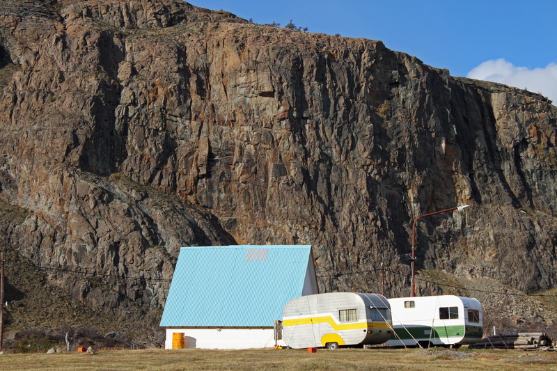 trailer, blue, formation, lonely, outdoor, no people, trailers, rural, land vehicle, rock - object, motor vehicle, environment, geology, cabin, rock formation