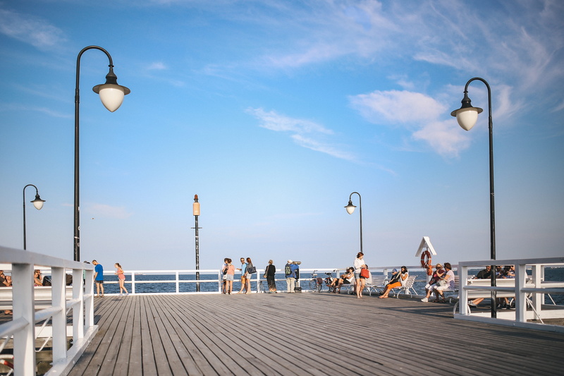 summer, footpath, city, pier, relaxing, travel destinations, beach, railing, incidental people, sky, architecture, lighting equipment, bench, people, sea