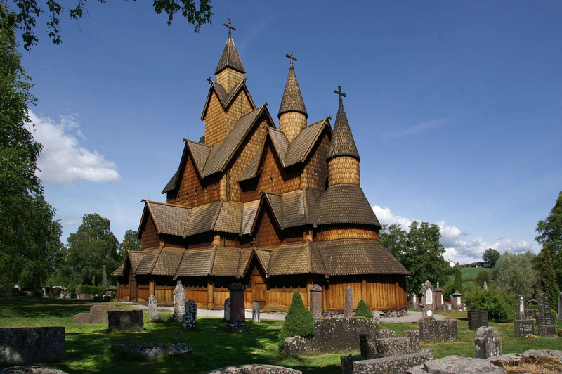 church, culture, religion, building, tomb, sunlight, heddal stave church, cross, sky, landmark, stave church, architecture, cemetery, plant, built structure
