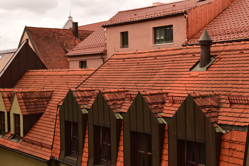 house roofs, residential district, architecture, roof tile, outdoors, no people, City, brick, day, brick wall, low angle view, building exterior, sky, built structure