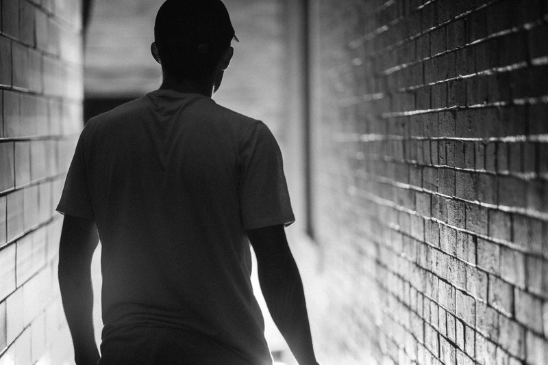 waist up, young adult, 8K, city, teenager, contemplation, photo, looking, architecture, grayscale, adult, built structure, wall - building feature, rear view