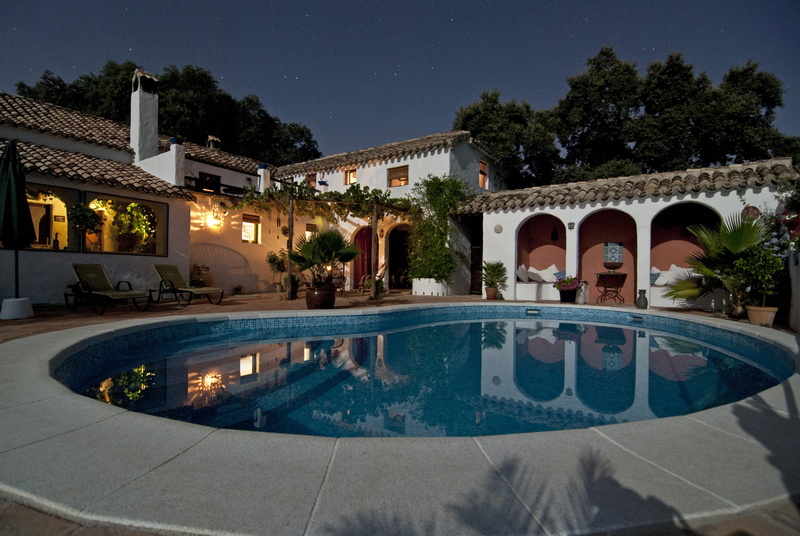 building exterior, arch, backyard, illuminated, water, stars, chairs, tree, villa, shingles, reflection, architecture, swimming pool, rich, no people, plant