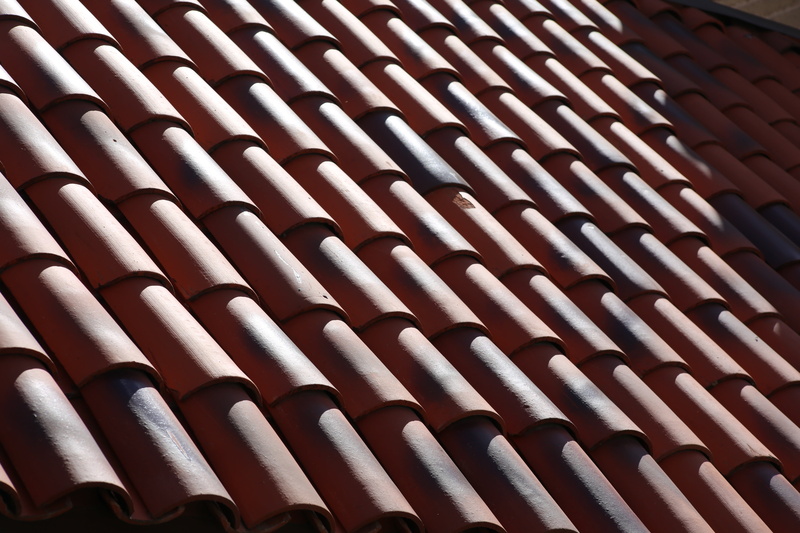 textured, in a row, texture, real estate, roof tile, large group of objects, pattern, shingles, sunlight, red, sunny, 5K, repetition, outdoors, background