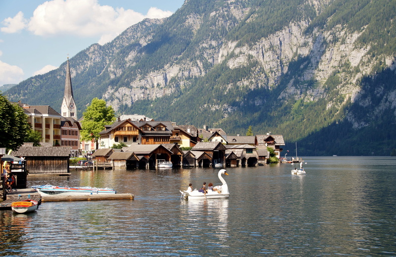 houses, travel destinations, lake, sky, tree, water, tourism, building exterior, day, summer, rowboat, architecture, unesco, hallstatt, tourists, scenics - nature