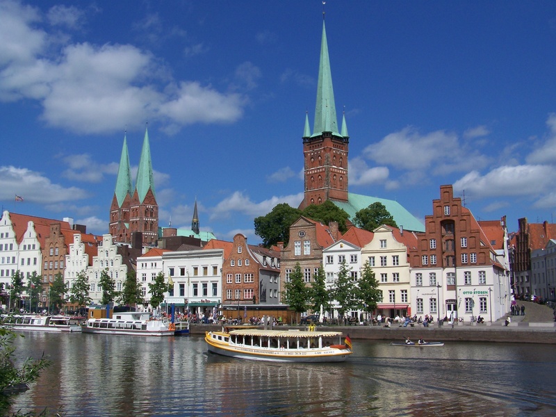no people, tourism, transportation, old town, architecture, spire, church, cityscape, beside, building, outdoors, sky, nature, boat, place of worship, building exterior