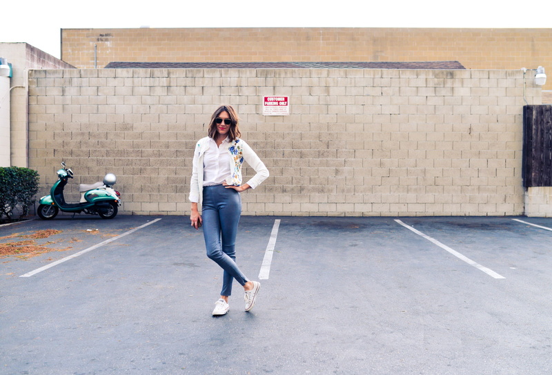 one person, transportation, girl, scooter, clothes, hairstyle, front view, white, young adult, women, parking spaces, near, built structure, lifestyles