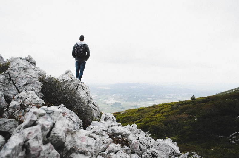 one person, grass, standing, remote, leisure activity, person, rock - object, people, outdoors, hiking, rock, looking at view, only men, rocks, summit