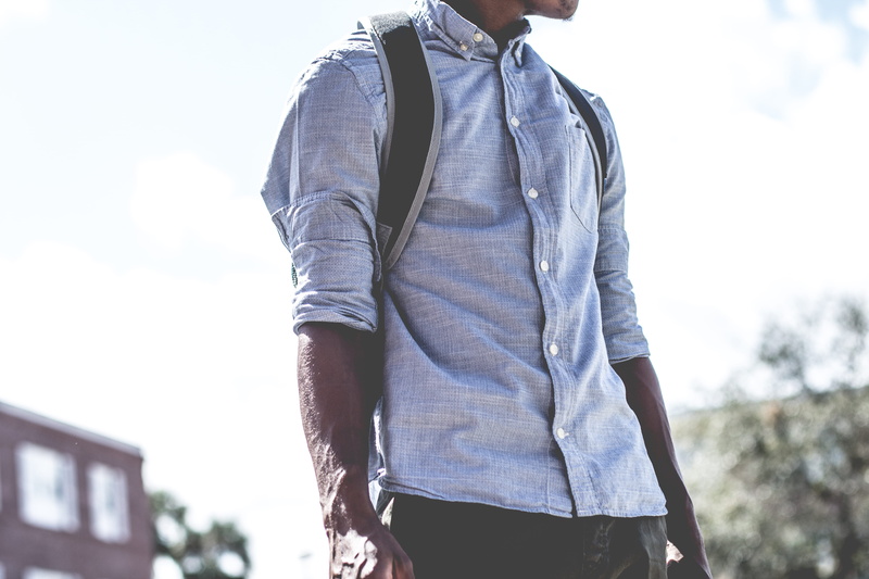 dress shirt, fashion, wearing, lifestyles, young Men, one Person, day, leisure activity, backpack, image Type, hiking, casual Clothing, jacket, men, time Of Day
