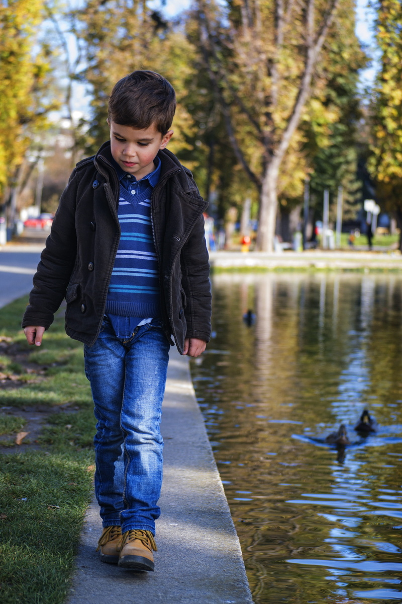 warm clothing, child, blue denim, denim jeans, lake, full length, coat, stripe, boy, childhood, vertebrate, leisure activity, 4K, outdoors, body, near