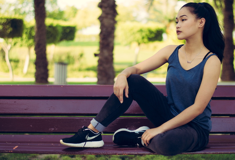 looking away, wear, park, lifestyle, woman, young adult, real people, sitting, 5K, leisure, nike, beauty, lifestyles, sneakers, seat, contemplation, women