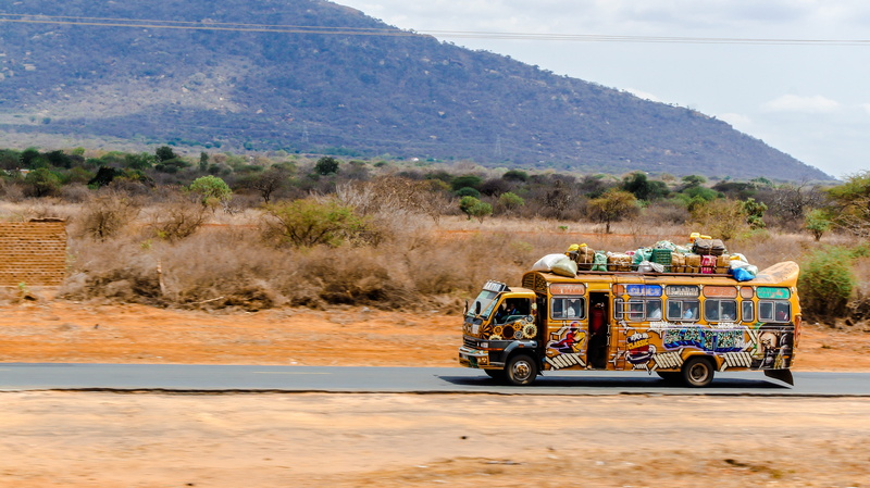 travel, tower, nairobi, land vehicle, mountain, on the move, skyscraper, africa, plant, sky, men, landscape, day, incidental people, public transport, town