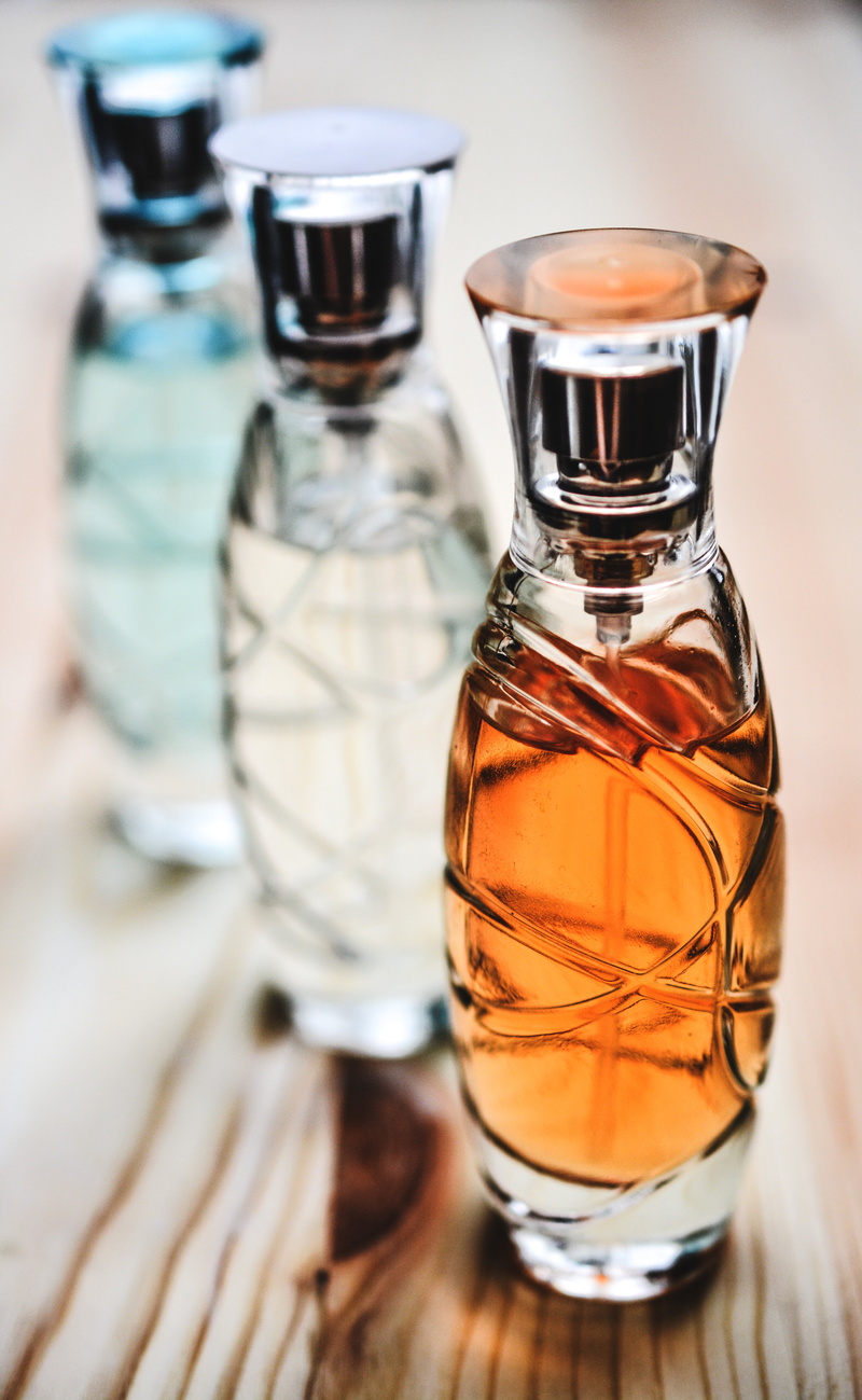 bottle, cologne, perfume bottle, close-up, aromatic, group of objects, smell, bottles, fragrant, fragrance, selective focus, spray, indoors, perfume, glass - material