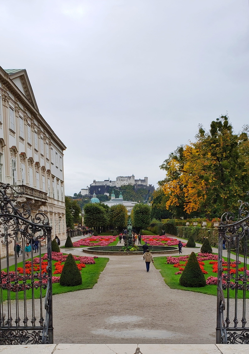 footpath, group of people, street, incidental people, person, tree, fence, direction, road, the way forward, garden, austria, palace, change, men, building exterior