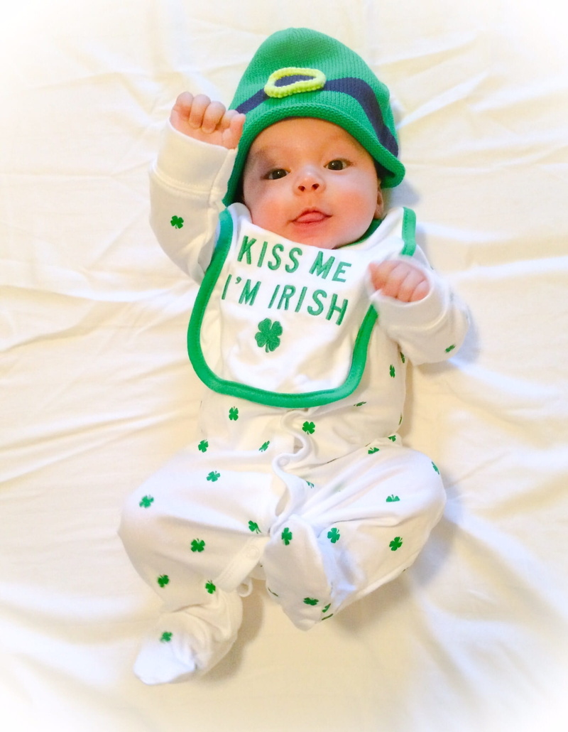 jig, 1080P, bed, looking at camera, one person, st patricks day, shamrock, high angle view, full length, clothing, baby, young, green, indoors, hat, toddler