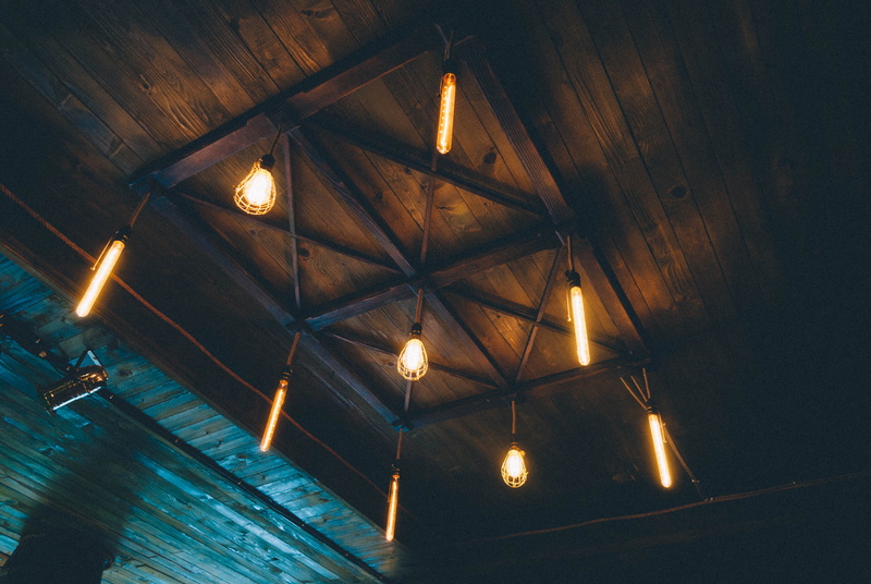 symmetry, light bulb, roof, architecture, pub, luck, built structure, light - natural phenomenon, no people, electric lamp, vranje, hanging, lighting equipment