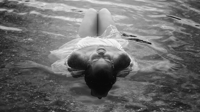 floating, wet clothing, high angle view, white dress, lying on back, legs, brunette, smiling, portrait, real people, nature, hairstyle, women outdoors