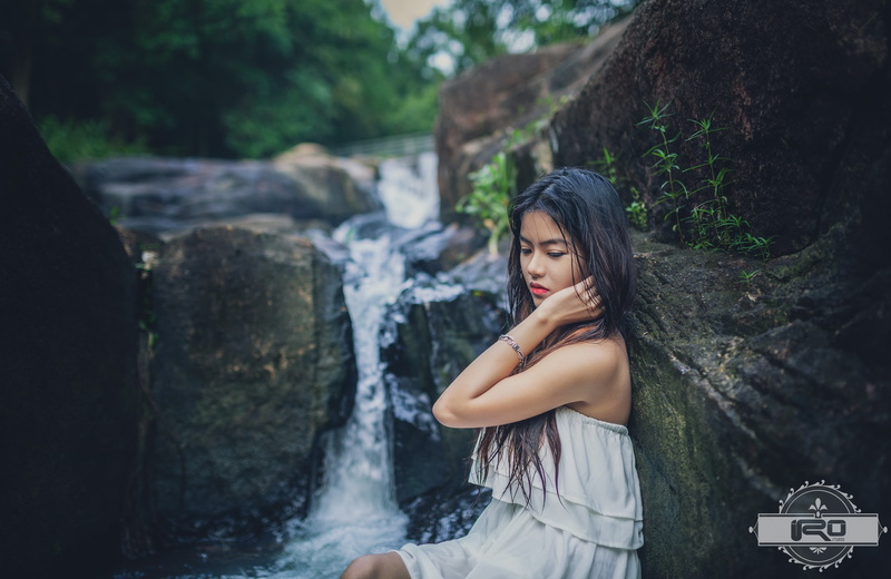brunette, outdoors, young adult, lifestyles, three quarter length, beautiful woman, wet hair, nature, white dress, real people, black hair, casual clothing