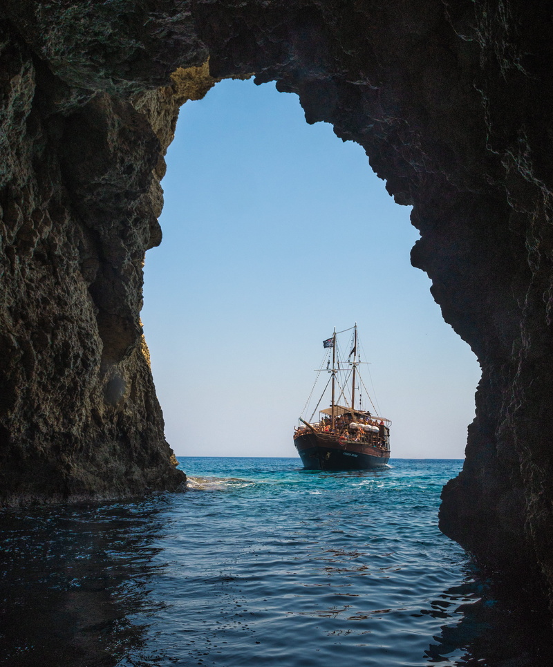 water, bay, beach, transportation system, rock, nautical vessel, limestone, solid, beauty in nature, mode of transportation, rock formation, clear sky