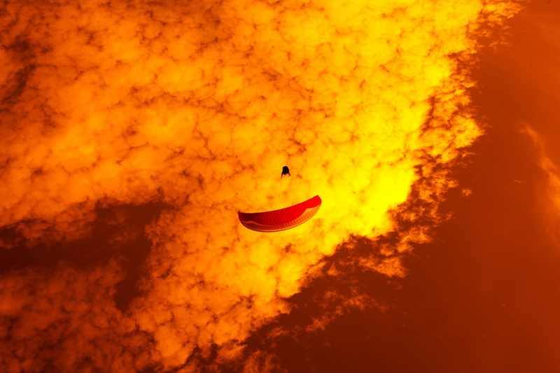 air vehicle, no people, outdoors, mountain, nature, 5K, eruption, sky, airplane, adventure, volcano, leisure activities, sunset, paraglider full collapse