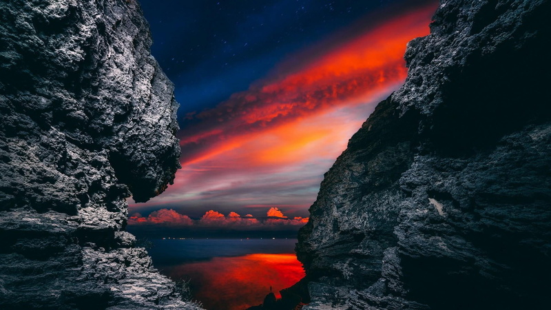 cloud - sky, atmosphere, orange color, landscape, reflected, outdoors, tranquil scene, non-urban scene, canyon, orange sky, tranquility, rock formation