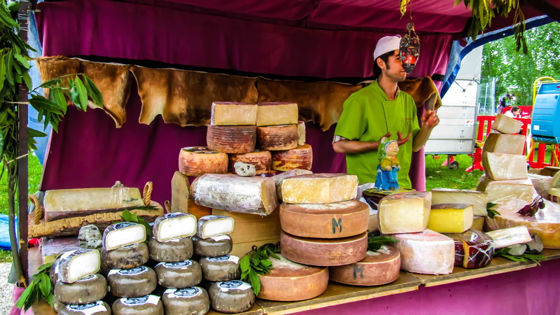 food and drink, market, abundance, goat cheese, freshness, front view, standing, manchego cheese, one person, business, cheese tortosino, selling, men