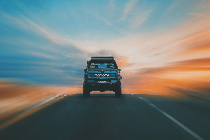 communication, land Vehicle, cloud - sky, car, text, travel, sky, semi-Truck, road, no people, Truck, dusk, multiple Lane Highway, mode of Transport, cars