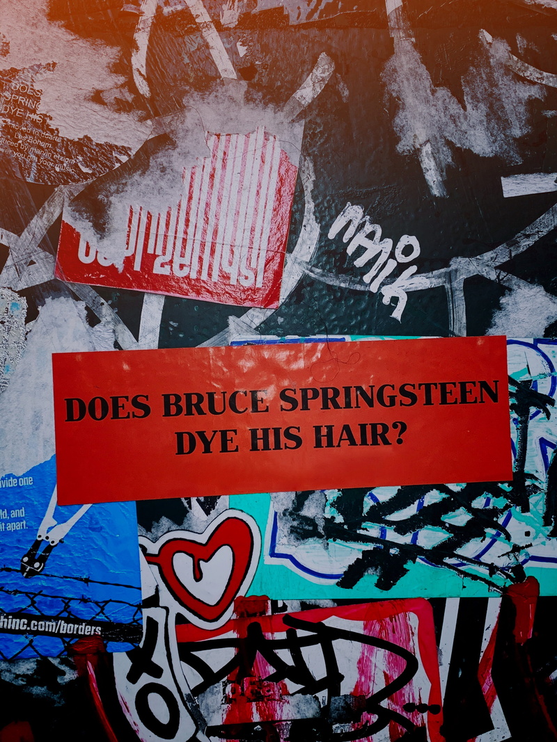 information sign, architecture, dye, script, hair, communication, bruce, poster, day, wall, text, red, sticker, outdoors, 4K, western script, multi colored