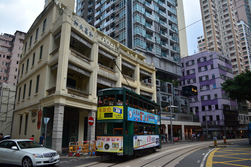 railway, office, kong, sign, urban, incidental people, motor vehicle, communication, city, city street, transport, hong, office building exterior, travel