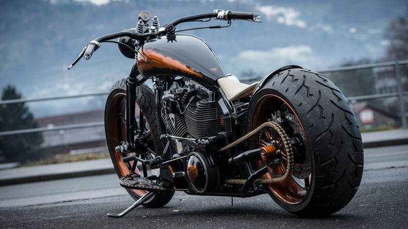 chopper, land vehicle, motor vehicle, tire, stationary, sky, road, metal, city, helmet, nature, cruiser, day, wheel, street, black color, parking, mode of transportation