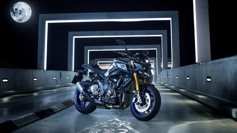 parking, motorcycle, land vehicle, stationary, vehicle, 1080P, speed, outdoors, built structure, motorcycling, travel, motor vehicle, motion, silver colored