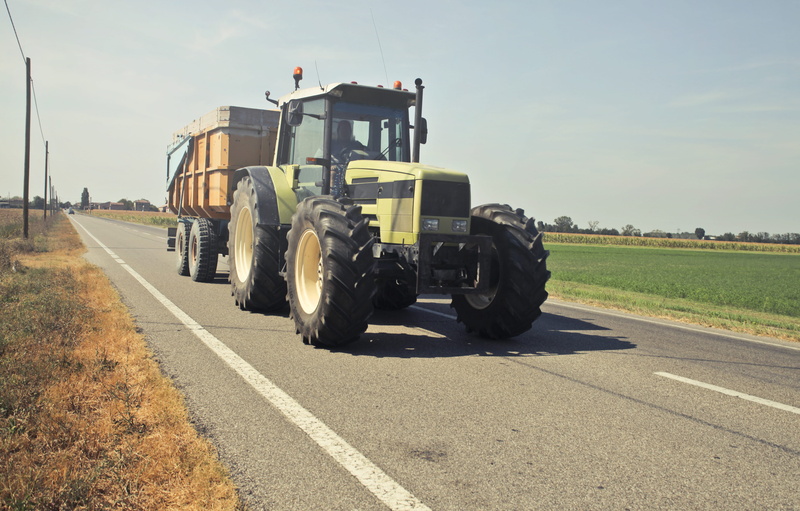 highway, man, countryside, machinery, no people, street, day, land vehicle, sign, nature, landscape, drive, machine, tractor, vehicle, sky, asphalt, city