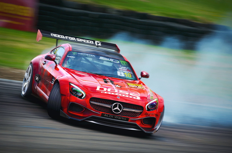 AMG, focus on foreground, western script, blurred motion, no people, day, render, Mercedes, retro styled, 2K, skid, text, motor vehicle, mode of transportation