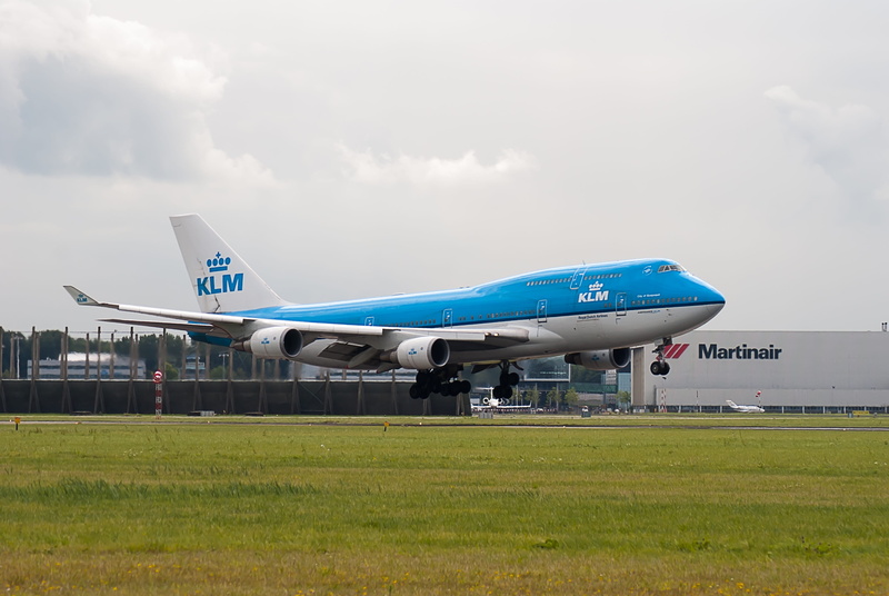 schiphol, grass, aerospace industry, mode of transportation, airport runway, airport, airport terminal, sky, architecture, journey, cloud - sky, no people